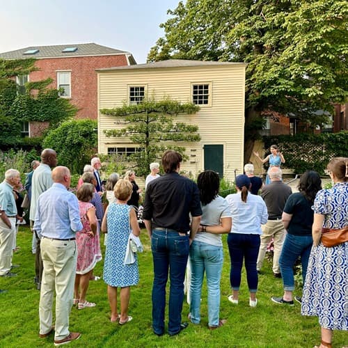 People outside listening to a speech